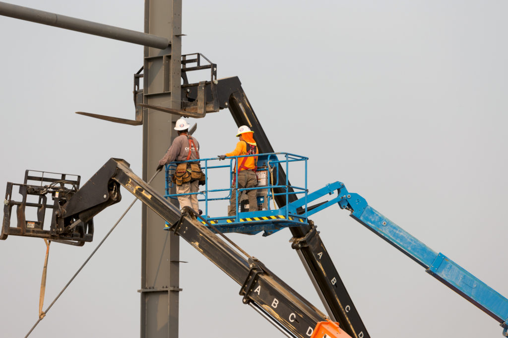 construction workers building the early stages of the frame