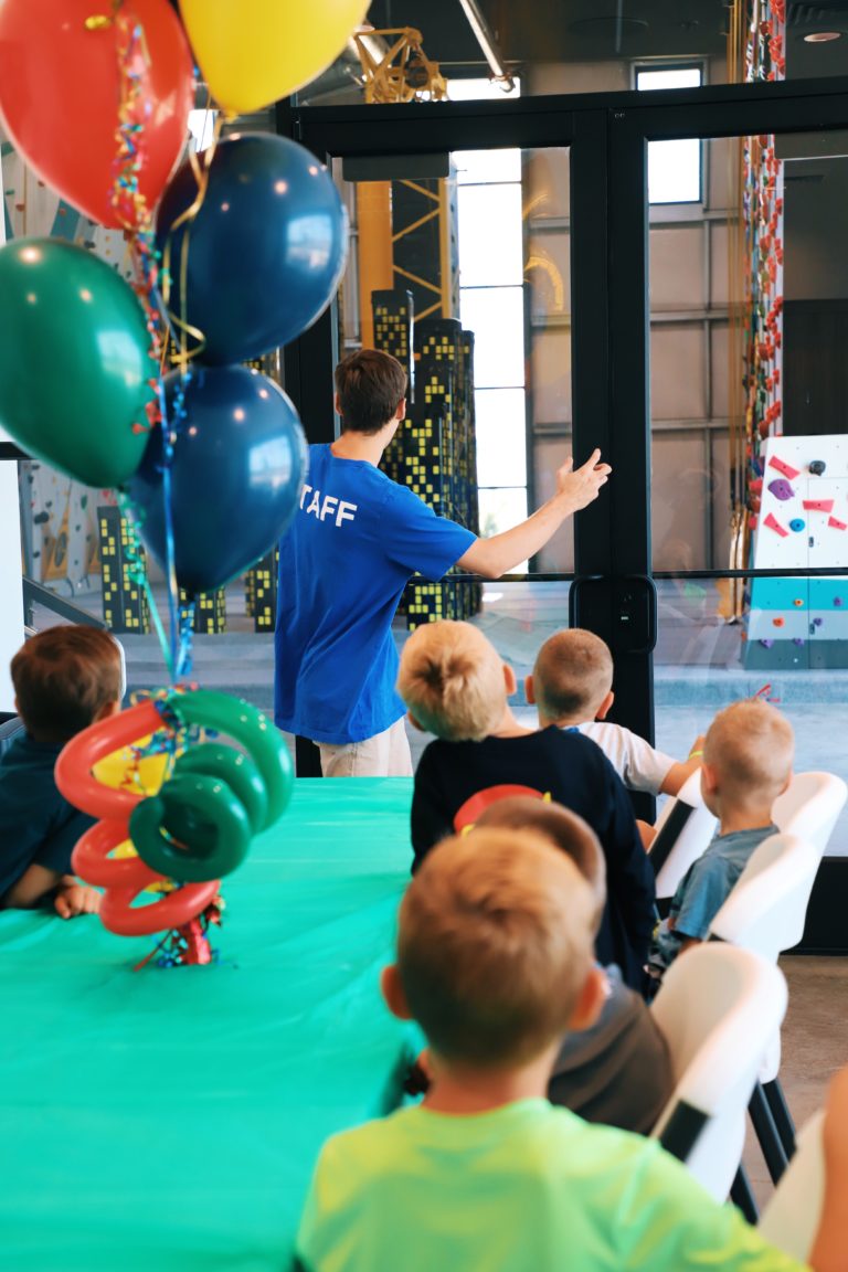 Staff member hosting kids at birthday party