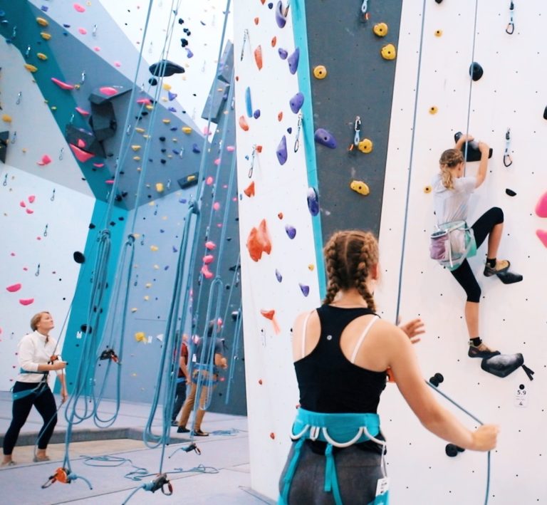 sister climbing together at alpine climbing adventure fitness