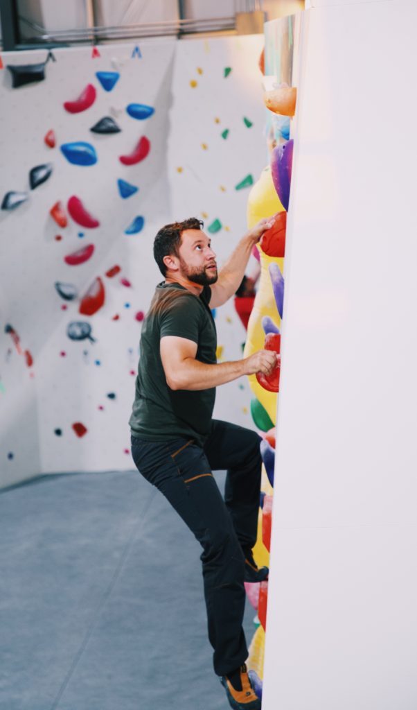 zech keenan bouldering on slab alpine member of the month