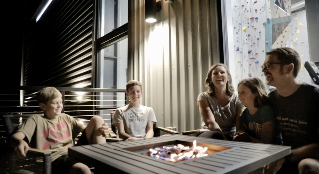 born family enjoying the patio at ripon climbing adventure center