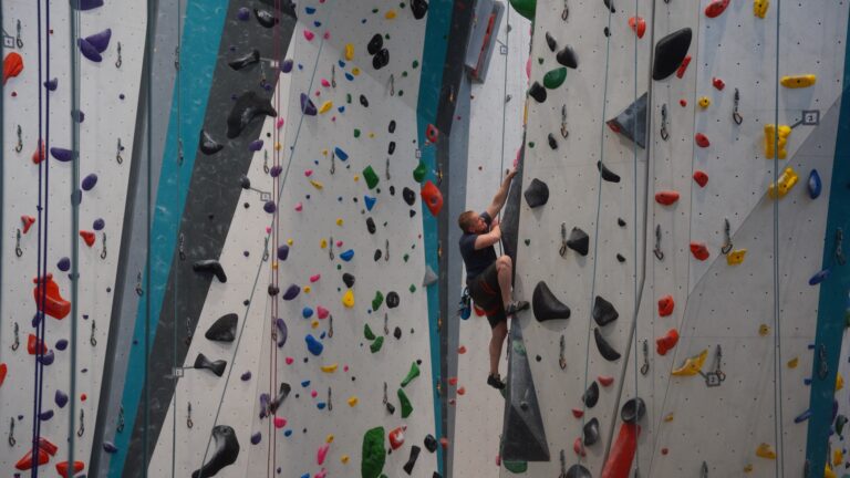 Climber on the tall walls during a Staff Guided Belay session
